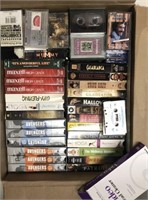 BOX LOT OF ASSORTED VHS AND CASSETTE TAPES