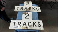 2 aluminum tracks signs