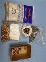 Bag of about 100 unprimed .223 rifle casings, box