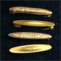 FOUR GOLD BABY PINS