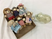 Collection of bears in a plastic piggy Banc