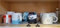 Coffee mugs on shelf