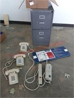 File cabinet, phones, surge protecters