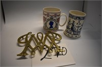 Assorted Items. Two Mugs And A Williamsburg Trivet