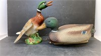 Two duck decorations, one ceramic, one plastic.