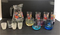 Matching pitcher and glasses and other glasses