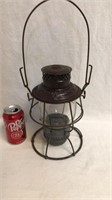 Antique railroad lantern with etched globe