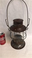 Antique railroad lantern with embossed globe