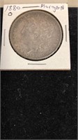 1880 O Morgan silver dollar