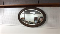 Oval oak framed beveled mirror