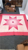 Star pattern quilt looks to be king or at least