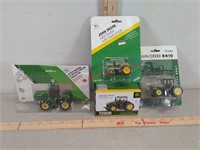4 - 1/64th scale john deere toy tractors