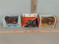 3 small model toy tractors
