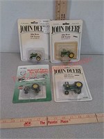 4 - 1/64 scale John Deere toy tractors