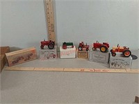 Assorted small toy tractors