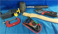 Multi meter, pliers, clamps, wooden axe handle