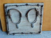 SPURS & BARBED WIRE ON BARN WOOD