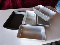 small baking pan and 3 loaf pans