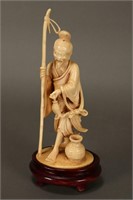 Chinese Carved Ivory Figure of a Fisherman,