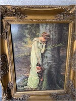 Large heavy gold tone framed woman at tree