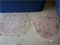 2 small pink rugs