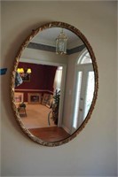 oval framed mirror
