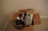assorted power supplies and surge protectors