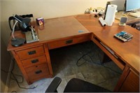 L shaped desk with contents