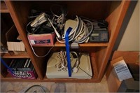 2 shelves of computer parts and scanner