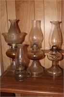 4 Clear Glass Kerosene Lamps, 1 is a Finger Lamp