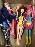 Group of six Barbie doll figures