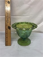Green carnival glass dish with grape pattern