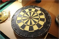 2 SIDED DART BOARD. ONE SIDE NEVER USED