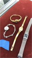 collection of four ladies wrist watches