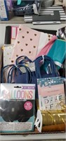 Flat of gift bags, tissue paper, stickers