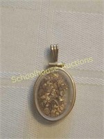 Pendant with gold flakes. About 2in
