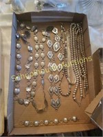 Flat full of silver necklaces, belts and