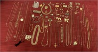83 pieces of gold colored costume jewelry, 31