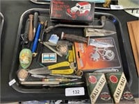 Tobacco tins, knives, pens, bike tool.