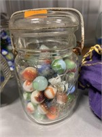 Vintage marbles in bale top jar