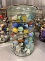 Vintage marbles in bale top jar