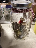 Mason jar with sewing thread