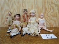 7 ASSORTED BISQUE DOLLS