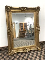 Grand miroir antique à cadre dorée