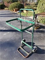 Metal framed cart for holding trash bag on wheels