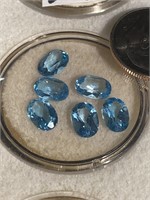 Blue topaz colored faceted stones