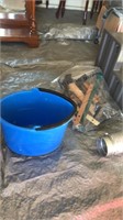 Plastic steps, weights, mop bucket, and hose