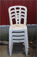 4 WHITE PLASTIC STACKING PATIO CHAIRS