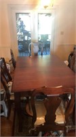 Cherry wood dining table w/ cloth and 6 dining