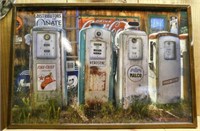 Metal gas station pumps picture framed by Linda